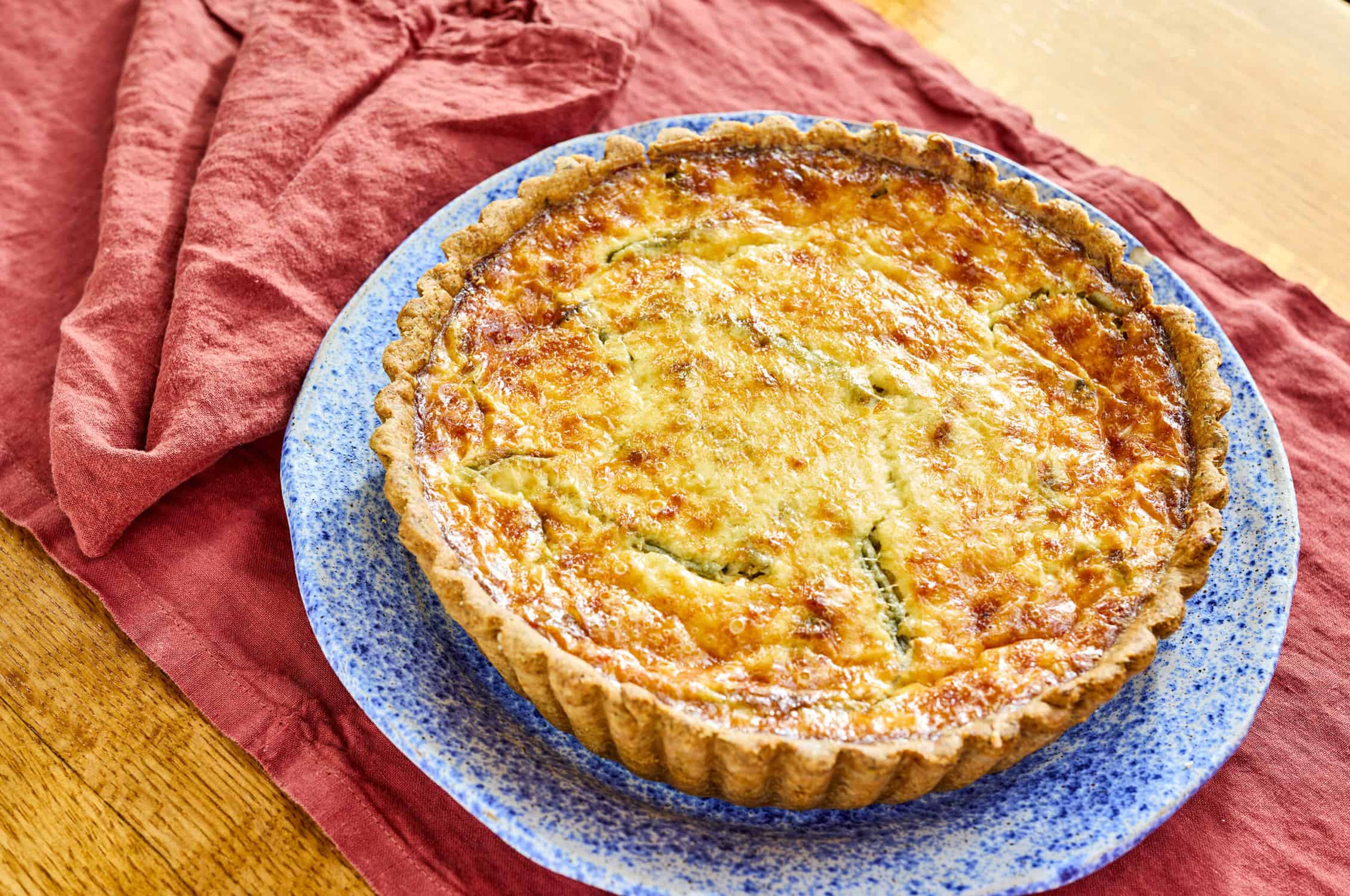 a perfectly baked quiche made with fresh farmer's market veggies