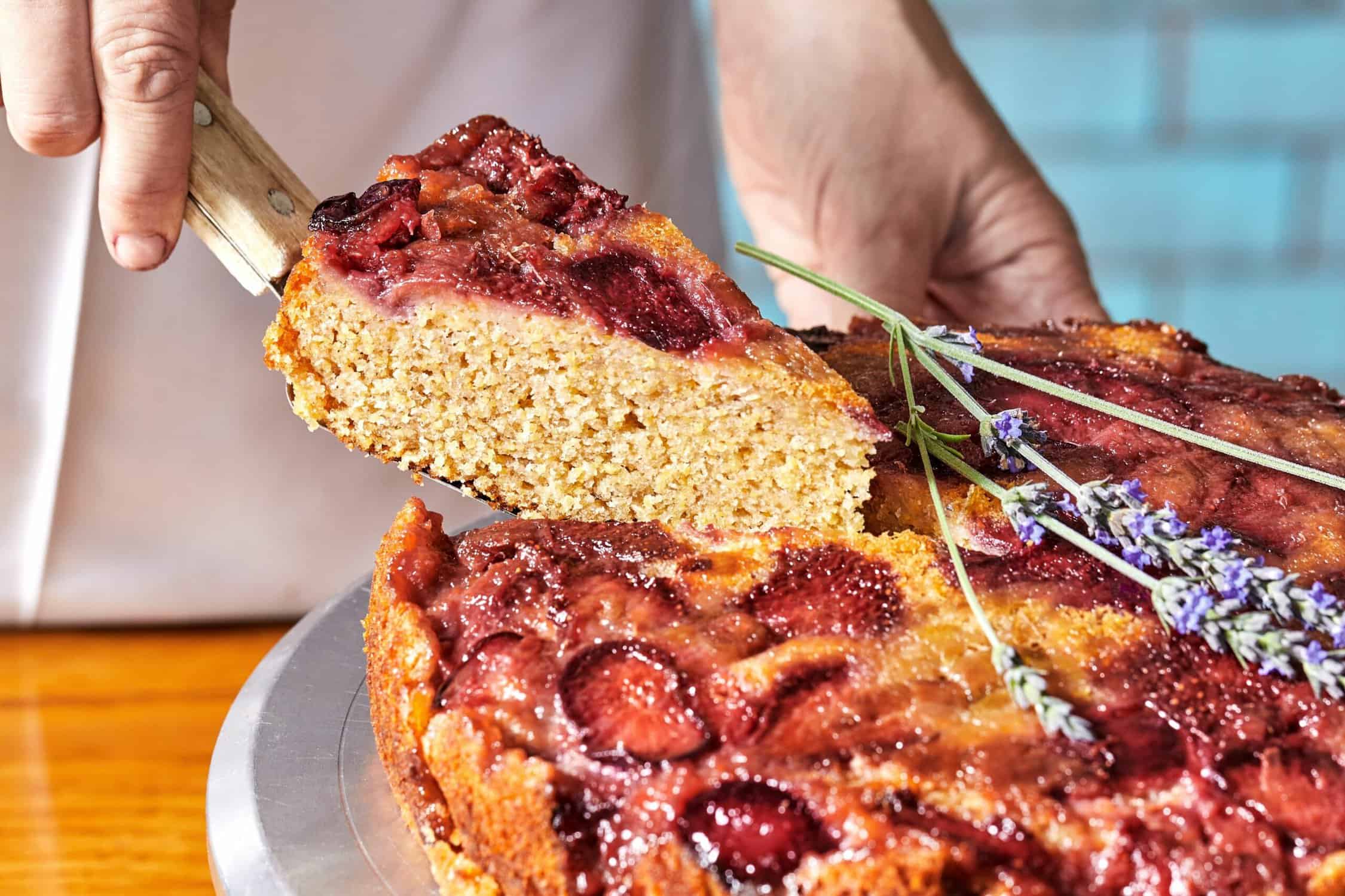 hands holding a slice of cake